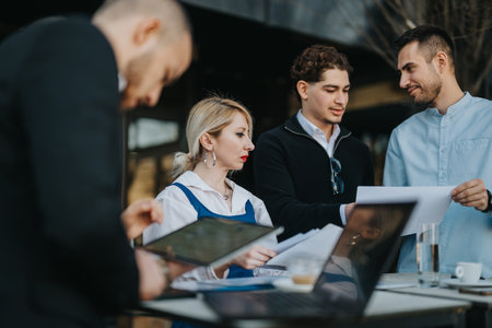 Team discussion and collaboration during a business meeting outdoors