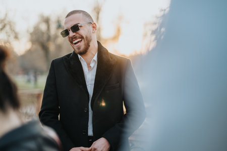 Business professional smiling outdoors in a natural setting during sunsetの写真素材