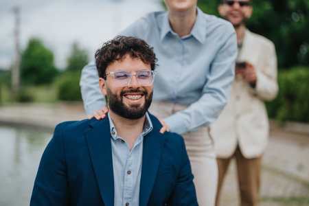 Smiling professionals during a meeting outdoors with cheerful and friendly atmosphereの写真素材