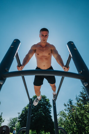 Young athlete performing exercise outdoors on a sunny day in a park