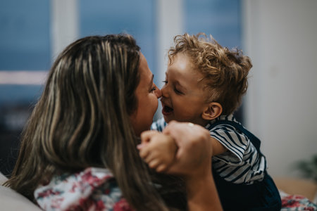 Mother and child share a joyful, loving embrace in a warm, intimate family moment