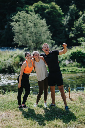 Friends smiling and enjoying physical activity together outdoors in a natural setting
