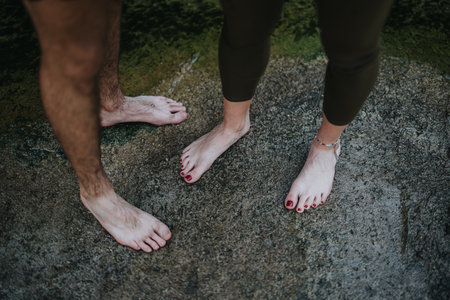 A Close-Up of Bare Feet Outdoors on Natural Groundの写真素材