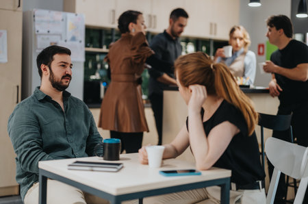 Colleagues Interacting in a Contemporary Office Break Room Environmentの写真素材