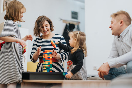 Family enjoying a fun activity together building a colorful block tower