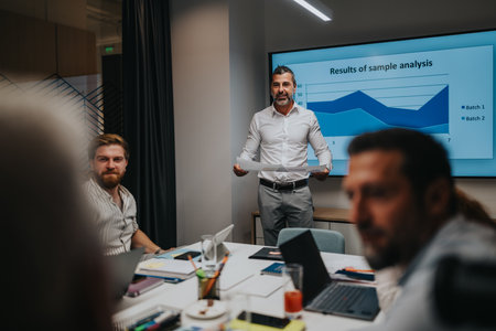 Business meeting in a modern office as presenter analyzes data on screen during analysis session