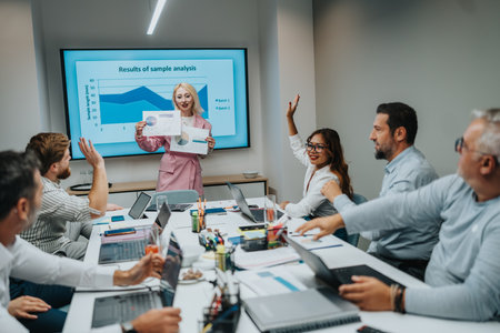 Business meeting in a modern conference room as a presenter shares analysis results with the team
