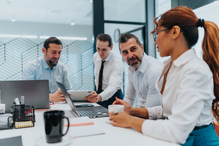 Multicultural team collaborates in a modern office during a focused business meeting