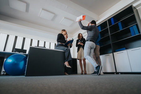Business team collaborates during a lively meeting in a modern office spaceの写真素材