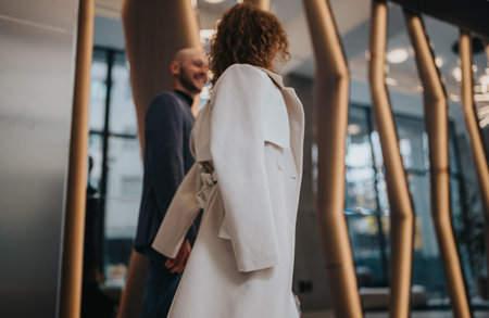 Business partners in a modern office share a conversation today.の写真素材