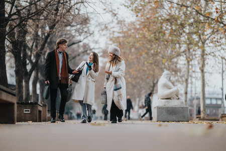 Friends stroll through a winter park in coats and scarves, sharing smiles and conversation