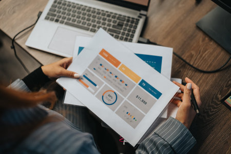 Professional desk setup with charts and documents during a data presentation and planning session