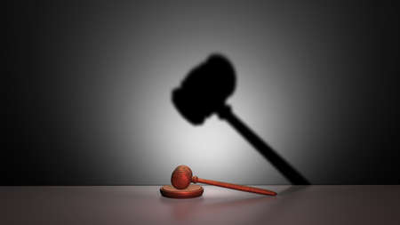 A gavel and its strange shadowの写真素材