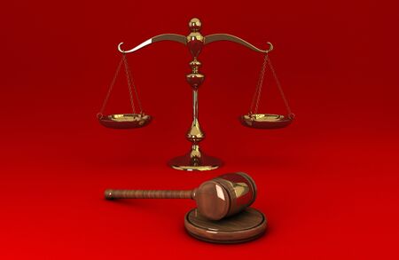 Golden scale and gavel isolated on red solid backgroundの写真素材
