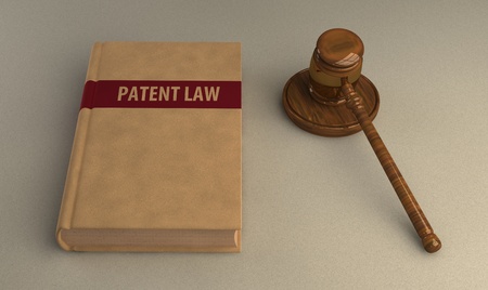 Gavel and patent law book on linen surface. Conceptual illustrationの写真素材