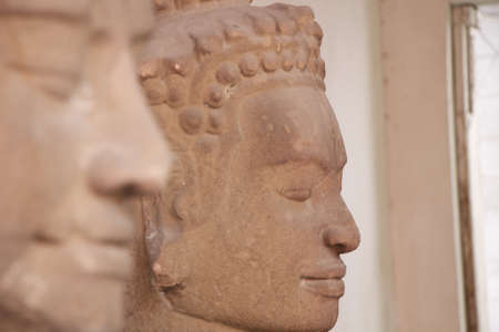 close up to buddha face made by stone