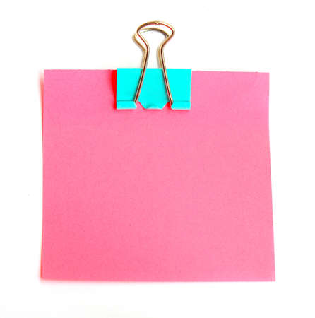 Pink Note paper with paper clip on white background の写真素材