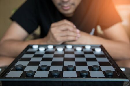 Businessman Concepr Strategic Planning, Man playing checkers gameの写真素材