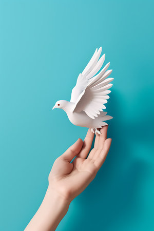 Hand holding white dove on turquoise background ai generatedの素材