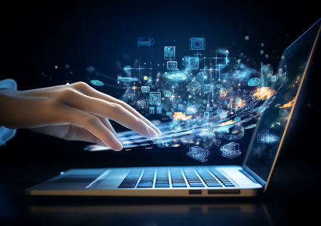 Close up of businesswoman hand using laptop with media icons on screenの素材