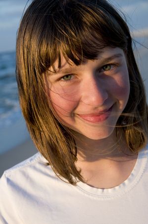 Beautiful young girl portrait on the beachの写真素材