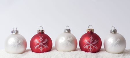 Christmas glass balls on snowの写真素材