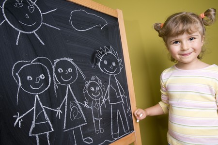 Cute girl drawing familyの写真素材