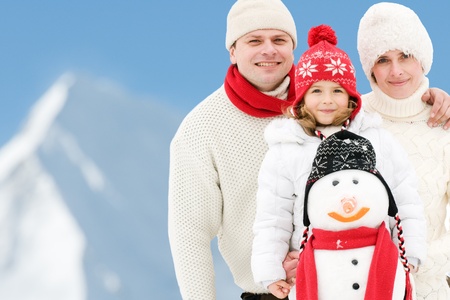 Happy family on winter vacation - copy spaceの写真素材