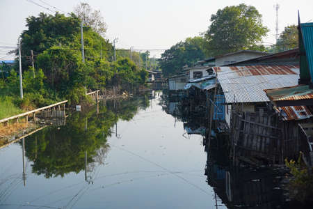 House on stilts. Views of the city's Slums from the river in Bangkok, Thailand.の写真素材