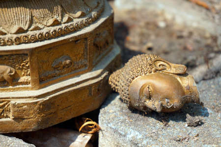 Broken buddha statueの写真素材