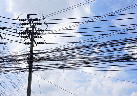 electricity high voltage pylon and white blue sky