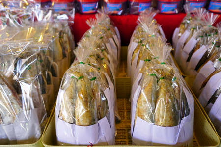 Fried mackerel fish packed in plastic bag, ready to sellの写真素材