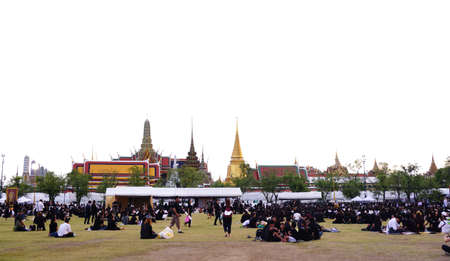 Bangkok,Thailand October 21 ,2016 : Thai people dressed in black as they sit and wait in line to offer condolences for Thailand's late King Bhumibol Adulyadej at the Grand Palace in Bangkokのeditorial素材
