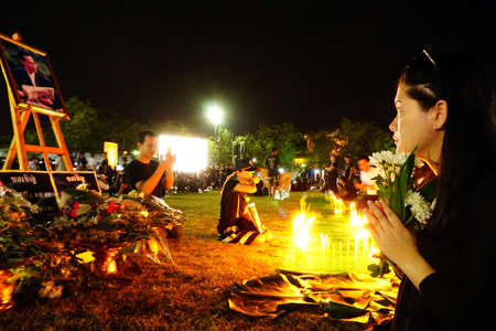 Bangkok,Thailand October 21 ,2016 : Thai people dressed in black come to offer condolences for Thailand's late King Bhumibol Adulyadej in Sanam Luang at the Grand Palace in Bangkokのeditorial素材
