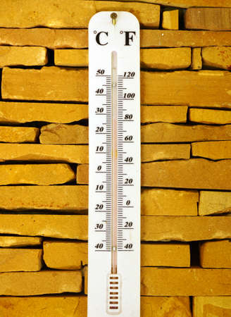Thermometer in brick backgroundの写真素材