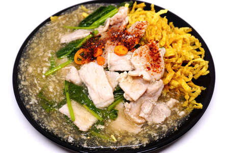 Crispy fried noodle pork with raadna sauce and top with thai chilli, One popular dish in Thailand.の写真素材