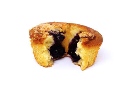Homemade blackberry muffins covered with sugar powder on white backgroundの写真素材
