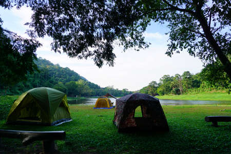 The camping tent and backpack in natural parkの写真素材