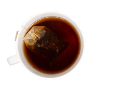 tea cup with tea bag. top view isolated on white backgroundの写真素材
