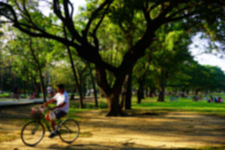 Blurred background, Cycling on the Wachirabenchathat Park or State Railway Public Park is a name of public park in Chatuchak district, Bangkok, Thailand.の写真素材