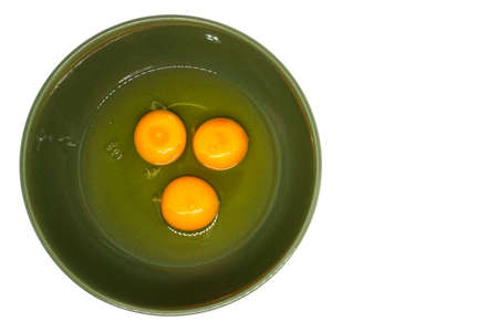 Egg yolke in green bowlの写真素材