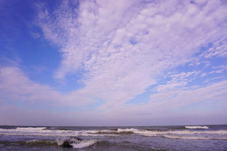 Blue sky ocean with cloudsの写真素材