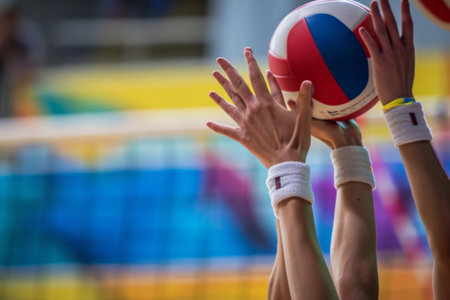 Group of People Engaging in Team Volleyball Action to Hit the Ballの素材