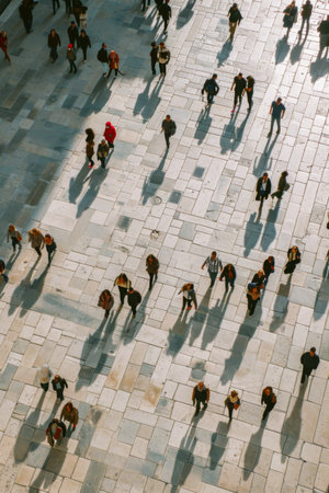 Group of People Walking Together on a City Streetの素材