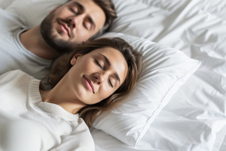A Man and a Woman Laying in Bed Togetherの素材