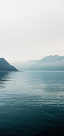 Large Body of Water With Mountains in the Backgroundの素材