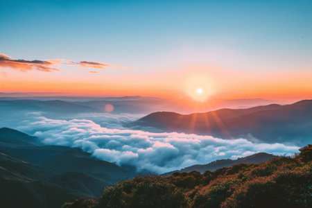 Sun Setting Over Clouds in Mountain Range, Serene Nature Landscape Photographyの素材