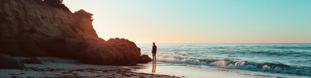 Person Standing on Beach Next to Oceanの素材