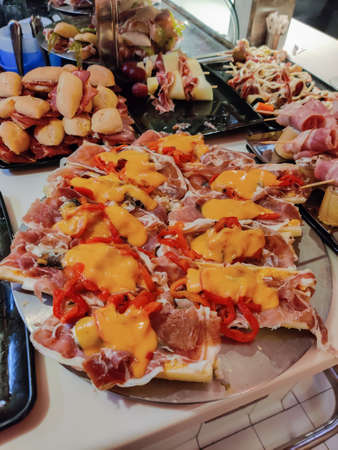 Spanish tapas bar of meat sausages in verticalの写真素材