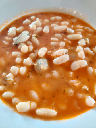 white beans with clams on white backgroundの写真素材